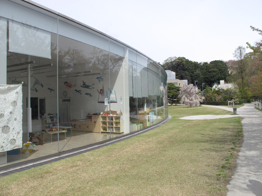 Glass windows allow natural light to filter in. This room is the nursery next to the children’s studio.