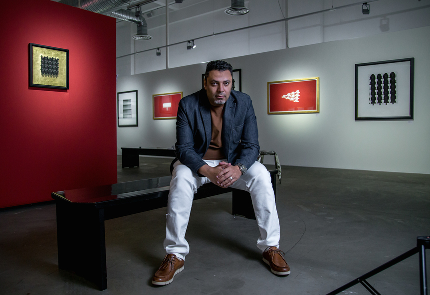 EHAB MAMDOUH at his solo exhibition, “Muqeem,” at Alāan Artspace, Riyadh, 2014. Courtesy  Alāan Artspace.