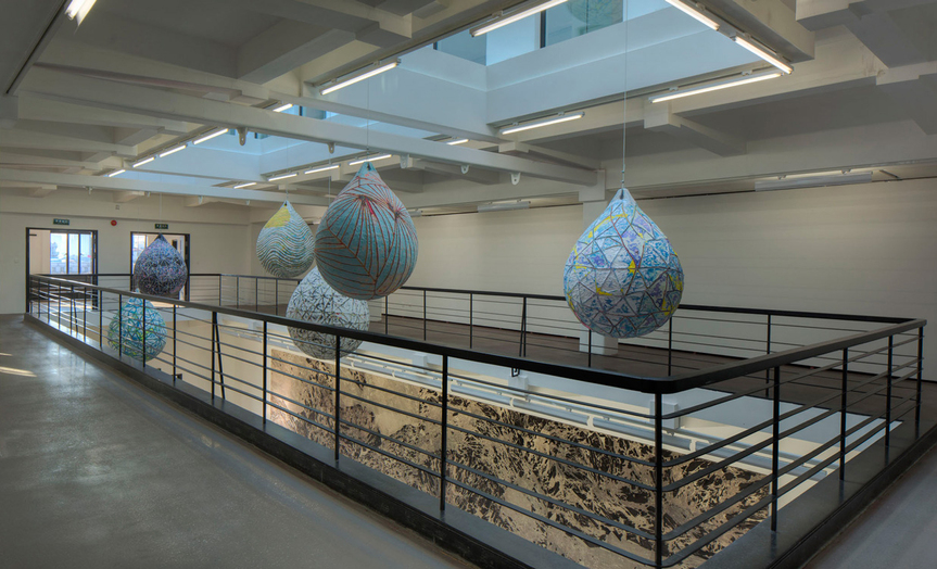 Installation view of MARK  BRADFORD’s “The Loop of Deep Waters” (2014), a series of hanging mixed-media collages, in “Tears of a Tree” at Rockbund Art Museum, Shanghai, 2015. Courtesy Rockbund Art Museum.