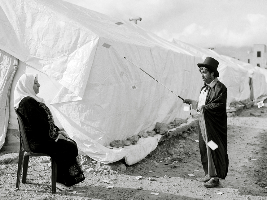 “My wife is blind…I tell her the stories of her favorite TV series, and sometimes change the script…to create a better atmosphere for her.” Photo by Omar Imam. Courtesy Prince Claus Fund Gallery, Amsterdam.