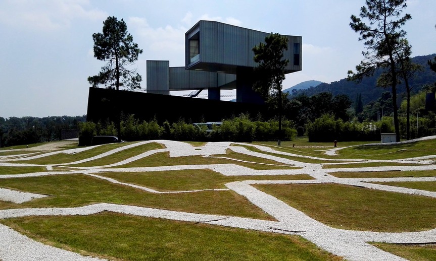 STEVEN HOLL’s Sifang Art Museum, which was constructed in 2011 and is located in the Pearl Spring Scenic Area near Nanjing, China. The uniquely structured building is based on the parallel perspective of early Chinese painting. The white paths in the foreground are part of Movement Field by Chinese artist XU ZHEN. All photographs by Andrew Stooke.