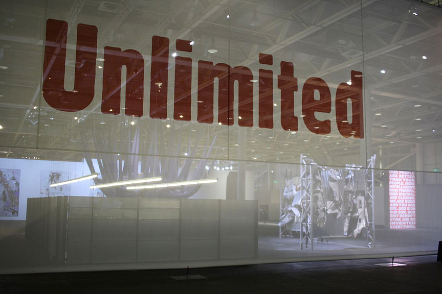 In Halle 1, Unlimited is staged for extra-large projects, including a blue-tentacled OTTO PIENE inflatable sculpture, an OLAF METZEL billboard sculpture and a BARBARA KRUGER light box that reads: “Our people are better than your people, more intelligent. More powerful, more beautiful and cleaner . . .”