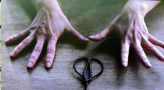 The exhibition focused on four main themes, such as ink, identity, duality and cinema. The latter was comprised of video installations by artists Ellen Pau, Angela Su and Ho Sin Tung. Shown here is a still from Tack Tack Tack (2017) by ANGELA SU. The artist roughly and rapidly stabs at the space between her fingers with a pair of scissors, testing her own sensory-motor coordination.