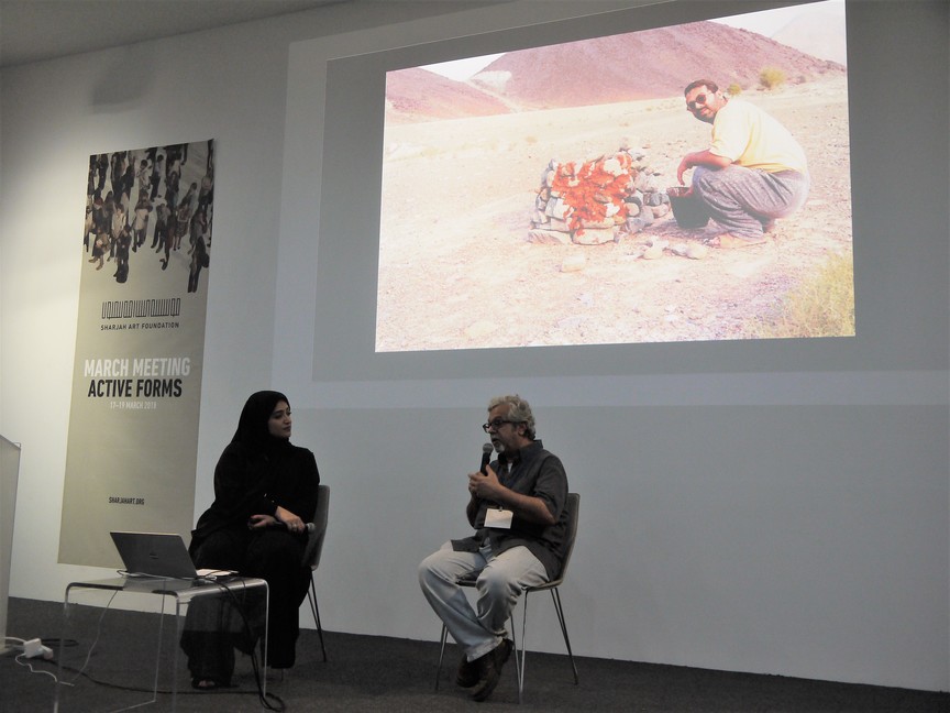 MOHAMMED AHMED IBRAHIM (right) and curator NOORA AL-MUALLA (left), discussing the artist’s career and his love for land art.