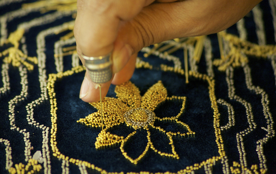 AISHA KHALID, Your Way Begins On the Other Side (detail), 2014, gold plated steel pins and fabric, dimensions variable. Courtesy the artist and Aga Khan Museum, Toronto.