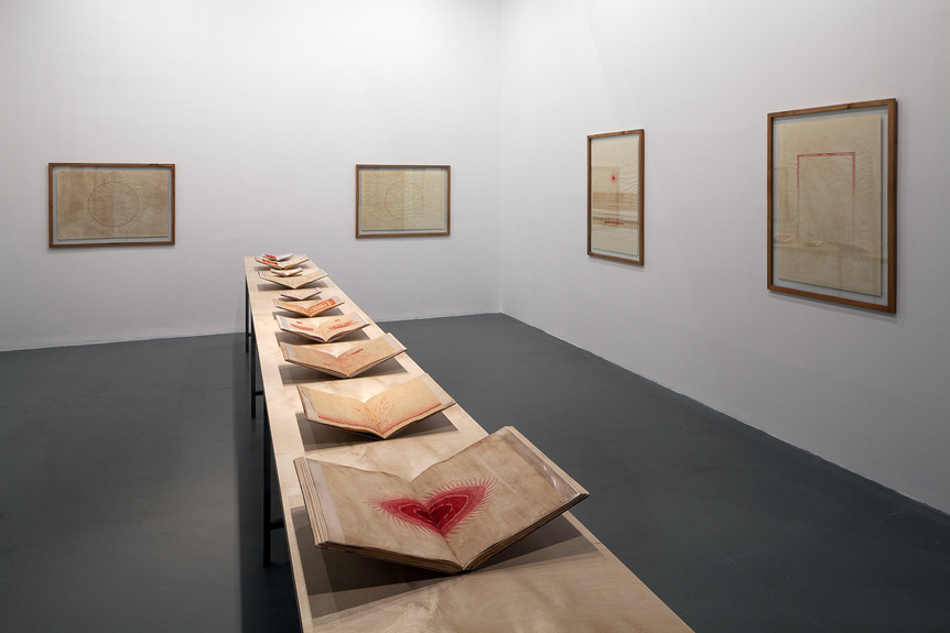 Installation view of AŞLI CAVUŞOĞLU’s Red/Red, 2015, Armenian cochineal ink and Turkish red pigment on paper and handmade notebooks, dimensions variable, at “Saltwater: A Theory of Thought Forms,” 14th Istanbul Biennial, 2015. Photo by Sahir Ugur Eren. Courtesy the artist.