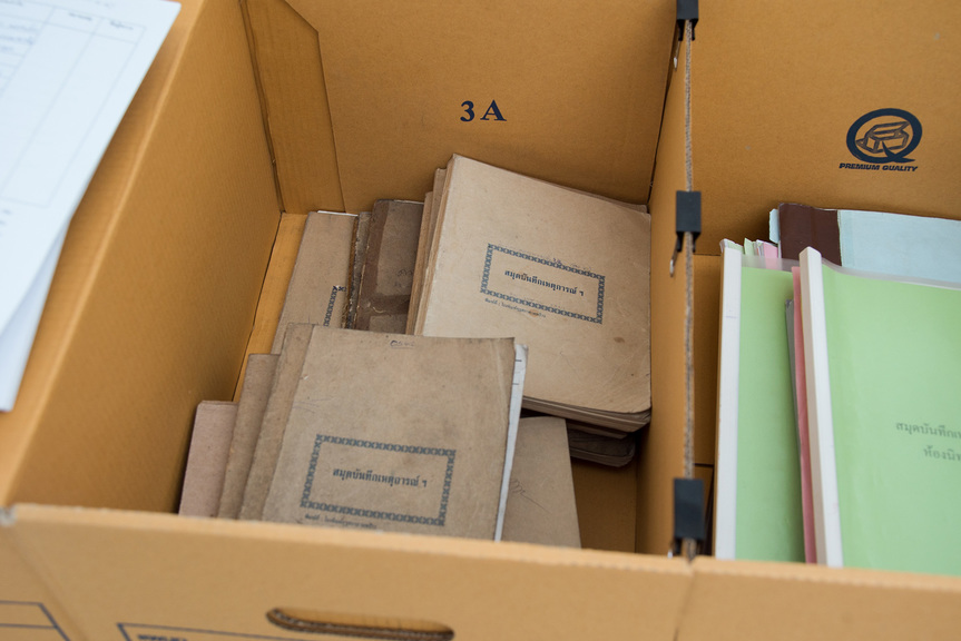 Detail view of 67 copies of logbooks and 7 cardboard archive storage boxes on loan from the National Gallery of Thailand, installed at PRATCHAYA PHINTHONG’s “This page is intentionally left blank,” Bangkok CityCity Gallery, Bangkok, 2018–19.