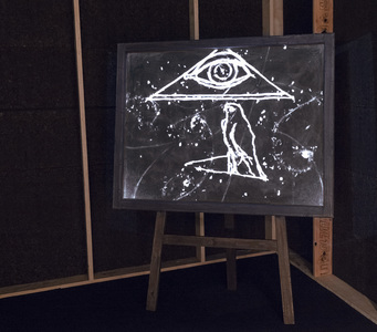 Installation view of WILLIAM KENTRIDGE’s Learning the Flute, 2003, 35mm film with color and sound transferred to video, wooden chalk board: 8 min, at "That Which We Do Not Remember,” Art Gallery of New South Wales, Sydney, 2018–19.