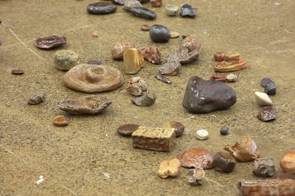 Detailed Installation view of Riverbed, 2018, wood-fired ceramic rocks, dimensions variable, made by workshop participants for FIONA JACK’s “Riverbed” at Artspace NZ, Auckland, 2018–19.