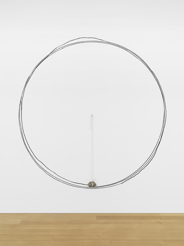 Installation view of KEIJI UEMATSU’s One Stone, 2019, stone, string, charcoal, diameter: 240 cm, at “Invisible Force,” Simon Lee Gallery, New York, 2019.