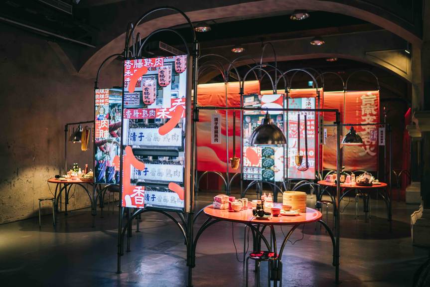 Multiple lightboxes depicting restaurant signage and round tables evoking a typical local eatery at the Tainan Pavilion. Courtesy Join Cultural Integration, Tainan.