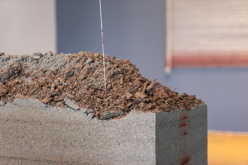 Detailed installation view of ROBERT ANDREW’s Presence, 2019, soil, ocher, oxides, string, aluminum, and electro-mechanicals, dimensions variable, at IMA Belltower, Judith Wright Centre of Contemporary Arts, Brisbane, 2019.