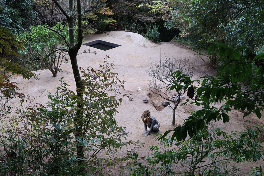 Installation view of PIERRE HUYGHE’s EXOMIND (Deep Water), 2017– , concrete cast with wax hive, bee colony, orange tree (Daidai), plum tree (Tobiume descendant), plants, sand, stones, calico cat, ants, spider, butterfly, concrete pond with water lilies (Giverny descendant), koi fish, axolotl and insects, dimensions variable, at Daizaifu Tenmangu Shrine, Fukuoka. Photo by Ichikawa and Kei Maeda. Courtesy the artist; Taro Nasu, Tokyo; The National Museum of Modern Art, Tokyo; and the Dazaifu Tenmangu Shrine, Fukuoka.