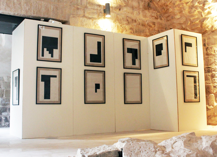 Installation view of QAIS ASSALI’s One Day After, 2016, ink on newspaper, 38 × 60 cm each, at Khan Al Wakala, Nablus, 2016.