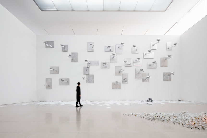 Installation view of TSUYOSHI HISAKADO’s Force, 2020, sound, paper, light bulb, aluminum, brass, glass, synchronous motor, wood, cable, screen print and others, dimensions variable, at “Practice of Spiral,” Toyota Municipal Museum of Art. Photo by Takeshi Koroda.