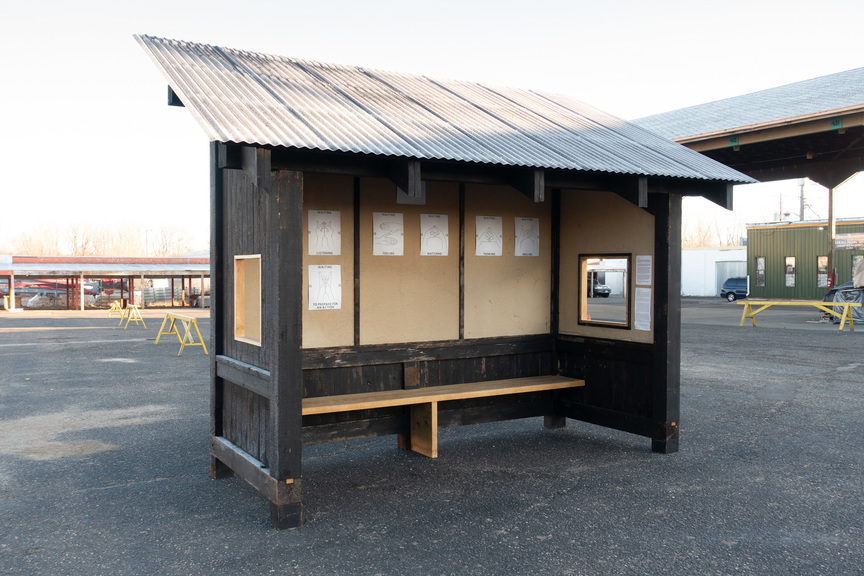 Installation view of TETSUYA YAMADA’s Waiting, 2020, cedar, homasote, corrugated metal, paper, dimensions variable, at HmongTown Marketplace, St. Paul, 2020.