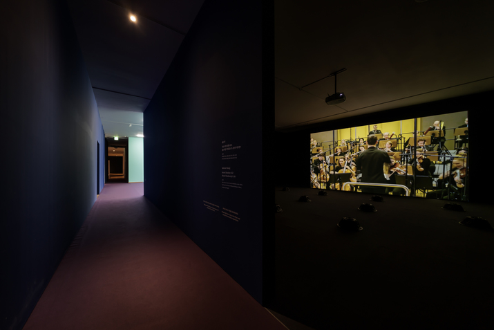 Installation view of SAMSON YOUNG’s Muted Situation #22: Muted Tchaikovsky’s 5th, 2018, video with 12-channel sound installation, color, 45 min. Courtesy the artist and Edouard Malingue Gallery, Hong Kong / Shanghai.