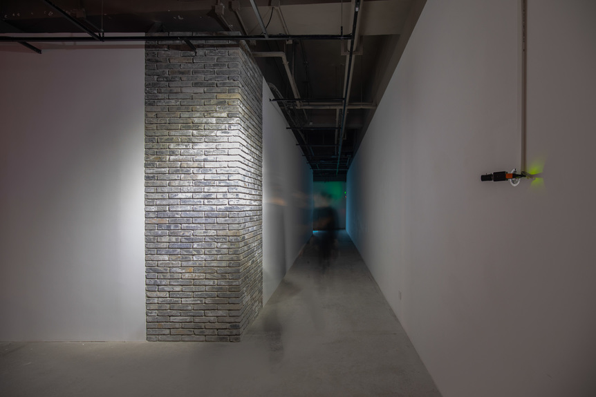 Installation view of WANG GONGXIN’s Two Square Meter Space, 1995/2020, CCTV video installation (projector, video camera), live feed transmission, dimensions variable, at “Refocusing on the Medium: The Rise of East Asia Video Art,” OCAT Shanghai, 2020–21. Courtesy the artist.